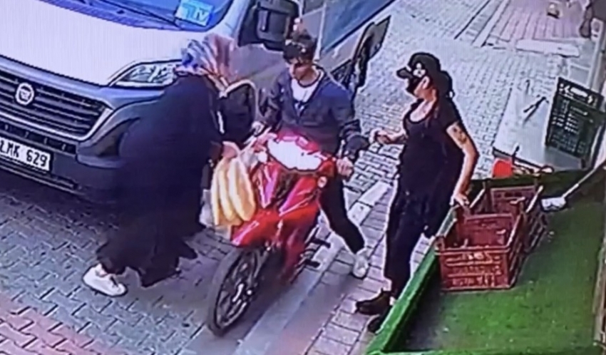 Cep telefonu hırsızı, motosikletini kadının üzerine sürerek kaçtı